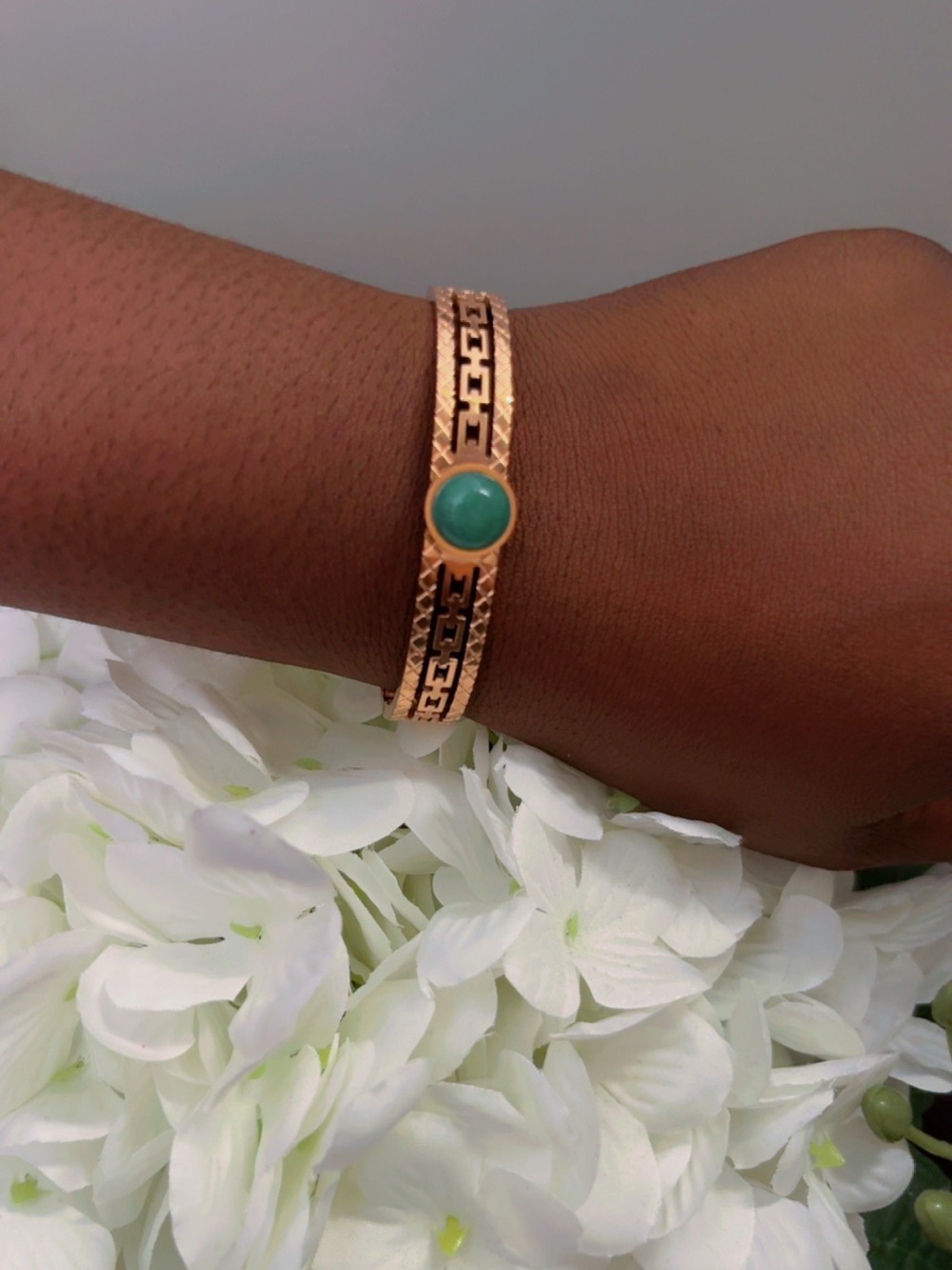 Gold-Tone Bracelet with Green Stone Center
